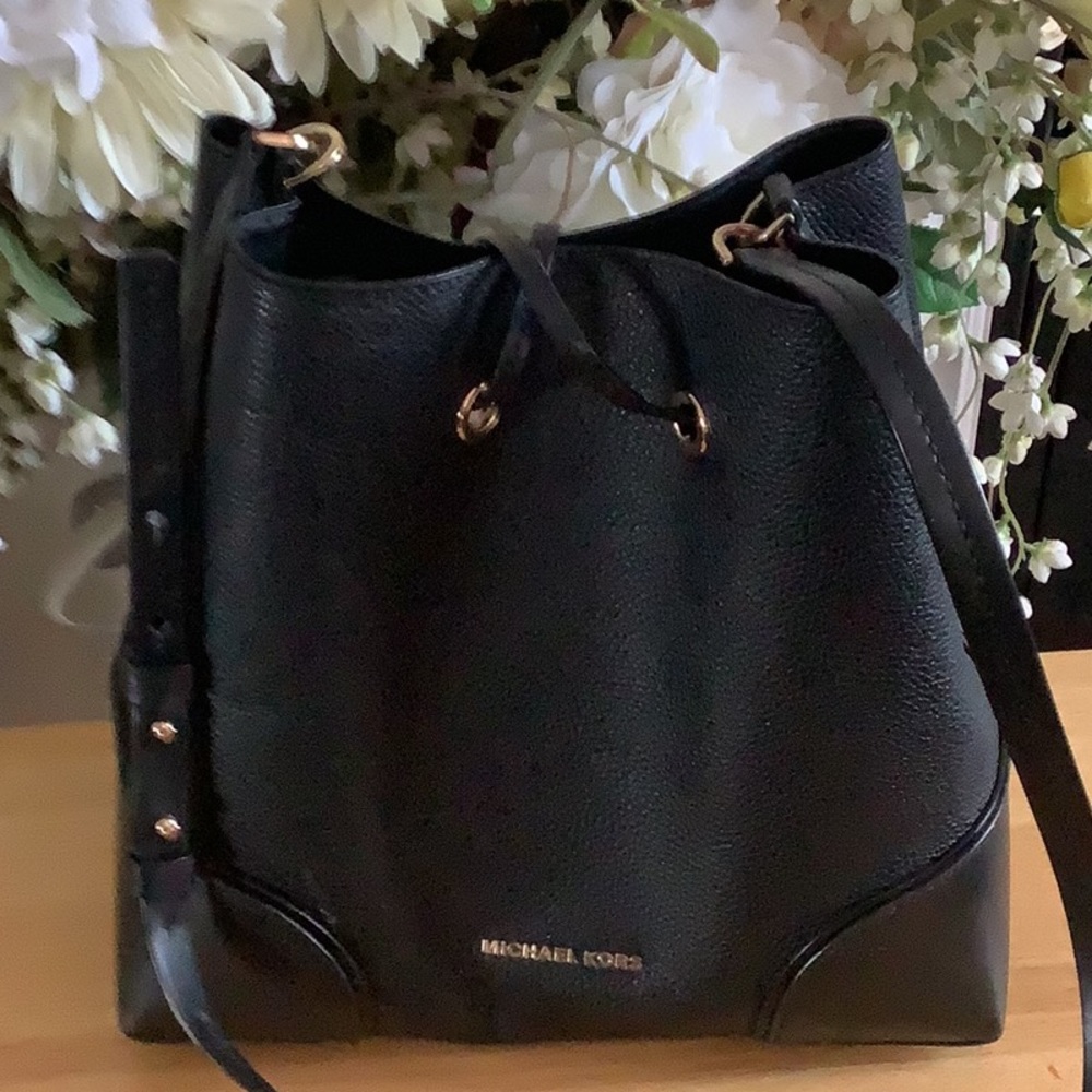 Michael Kors bag good shape but the strap has some damage